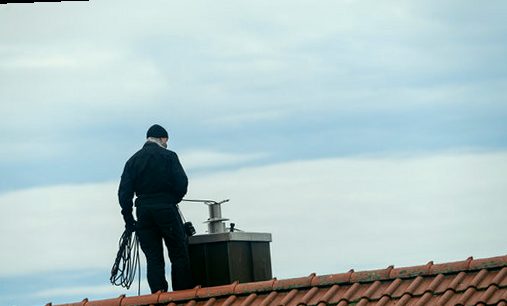 Sweep working rooftop gear over an open flue